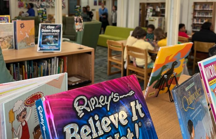 students reading in library